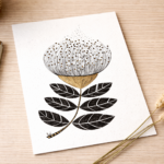 Illustration d’une fleur stylisée en noir et or, au dessin graphique et aux feuilles contrastées sur fond clair.